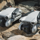 The folded DJI Mini 3 Pro sitting next to the folded DJI Mini 3.